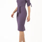 brunette model wearing diva catwalk tryst pencil purple dress with sleeves and belt detail at the front with rounded neckline front