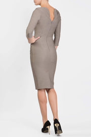 Model wearing the Seed Agatha in pencil dress design in taupe brown back image