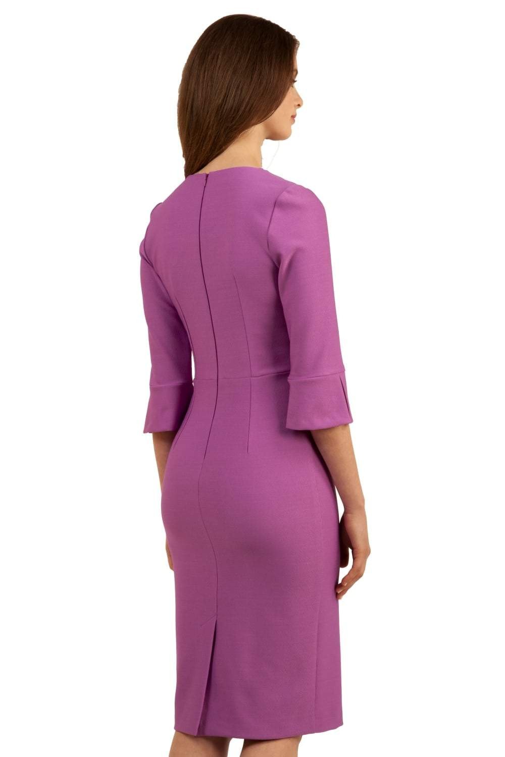 Brunette model is wearing couture stretch seed pencil bell 3/4 sleeve pencil dress by diva catwalk in Magenta Mist back image
