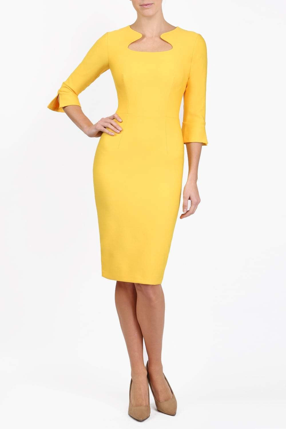 Brunette model is wearing couture stretch seed pencil bell 3/4 sleeve pencil dress by diva catwalk in Daffodil Yellow front image