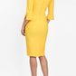 Brunette model is wearing couture stretch seed pencil bell 3/4 sleeve pencil dress by diva catwalk in Daffodil Yellow back image
