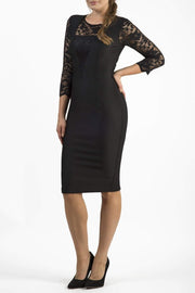 Brunetter Model is wearing seed couture lace pencil dress by diva catwalk in black front