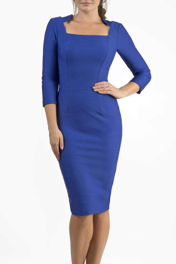 model is wearing seed rowena pencil dress with sleeves and square neckline in monaco blue front