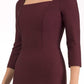model is wearing seed rowena pencil dress with sleeves and square neckline in port royale front close up