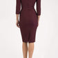 model is wearing seed rowena pencil dress with sleeves and square neckline in port royale back