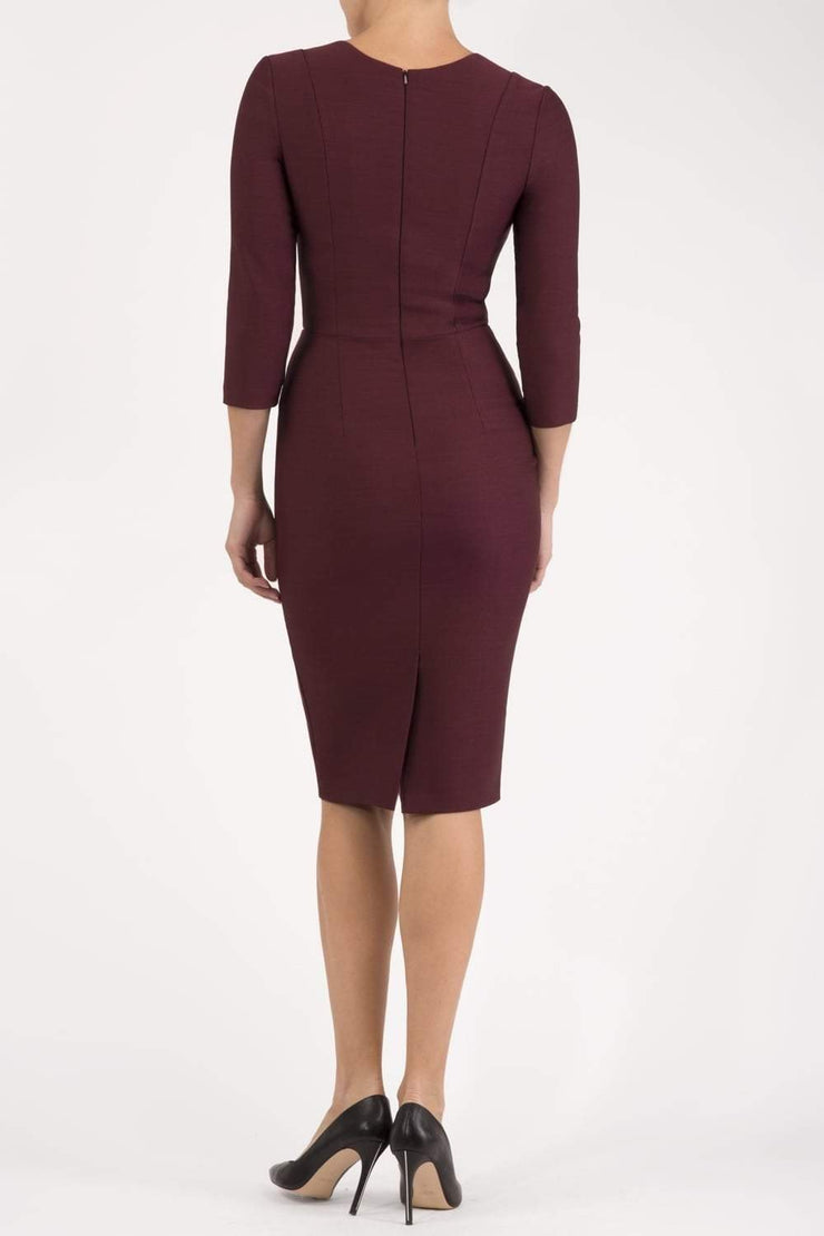 model is wearing seed rowena pencil dress with sleeves and square neckline in port royale back