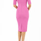 model is wearing diva catwalk solway pencil dress cold shoulder detail and rounded neckline in begonia pink back