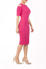 model is wearing diva catwalk solway pencil dress cold shoulder detail and rounded neckline in pink side