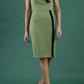 brunette model wearing Diva catwalk Suzy pencil sleeveless dress with v-neckline and wide wasteland in dill green front