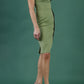 brunette model wearing Diva catwalk Suzy pencil sleeveless dress with v-neckline and wide wasteland in dill green front