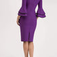 blonde model wearing diva catwalk tina pencil skirt dress with rounded neckline and flute sleeve in royal purple back