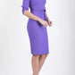 brunette model wearing diva catwalk tryst pencil opulent violet dress with sleeves and belt detail at the front with rounded neckline front