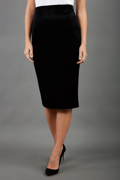 model is wearing diva catwalk triste velvet pencil skirt in black front